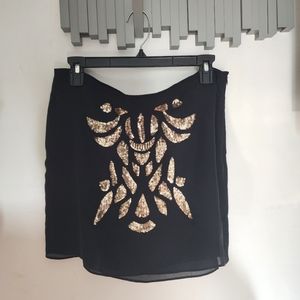 Black skirt with gold sequence design